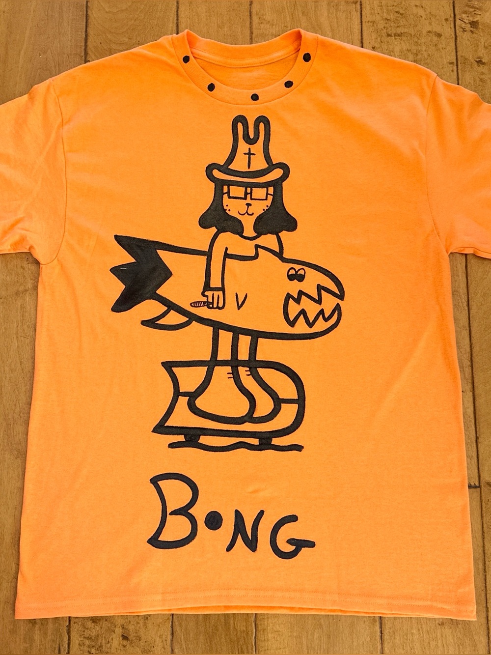Orange Graphic Tee with Black Cartoon Surf Design